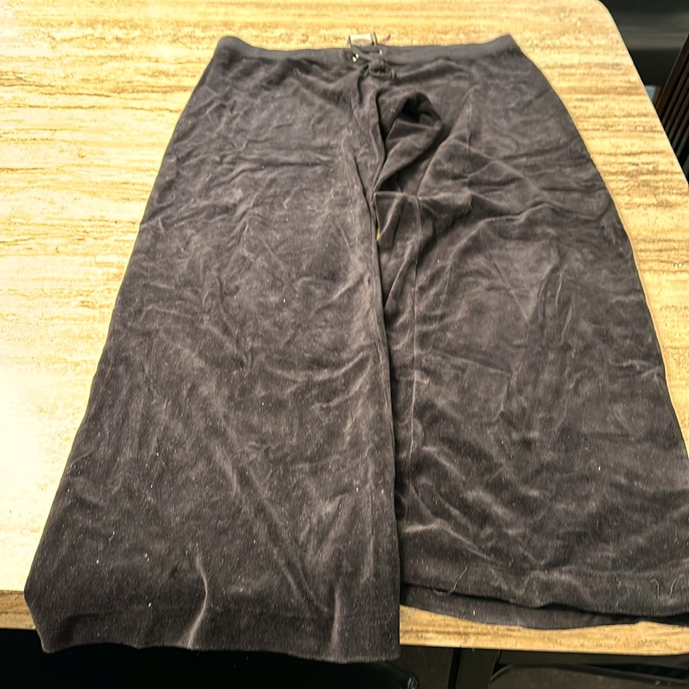 Black velvet, juicy couture, jogging pants, sequin emblem on the rear.